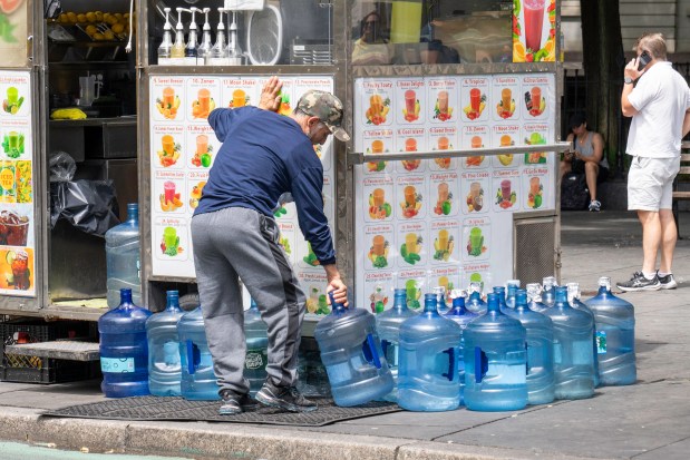 A vendor outside City Hall in Manhattan is well stocked with water on a hot day in New York City on Thursday, June 20, 2024. (Theodore Parisienne for New York Daily News)