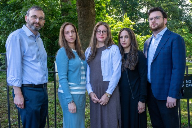 The family of Albert Itzkowitz attends a press conference in Kissena Park on Thursday.