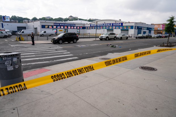 Police investigate after a 32-year-old man was was shot to death on W. 207th St. and Ninth Ave. in Inwood early Sunday.