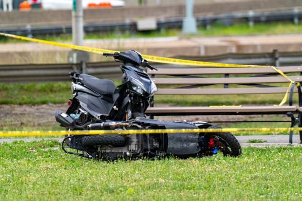 Two mopeds are seen at the crime scene after a man was fatally stabbed in Little Bay Park in Queens early Friday.