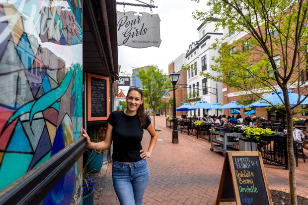 Iryna Patterson, owner of Pour Girls and Las Reinas Cocina on the Queens Way pedestrian corridor, poses for a portrait in Hampton, Va., on June 8, 2026.(Peter Casey / The Virginian-Pilot)
