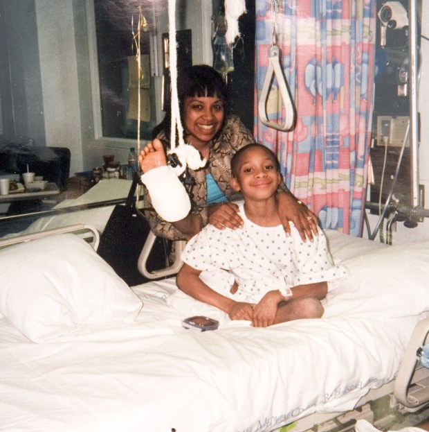 Thomas Little and his mother, Josephine De Jesus, are pictured on Thomas' 10th birthday at Bellevue Hospital after he was injured in a trash compactor. 