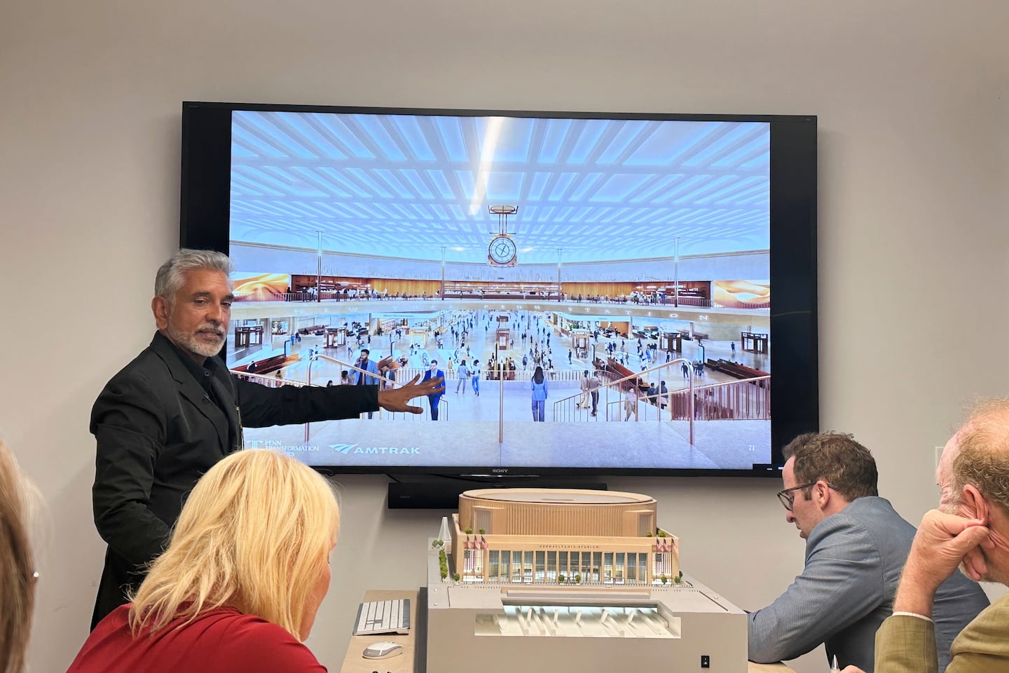 Vishaan Chakrabarti, one of the leaders of the team awarded the project to dramatically redesign New York City's Penn Station, presents architectural designs during a presentation Monday, June 8, 2026, in New York. 