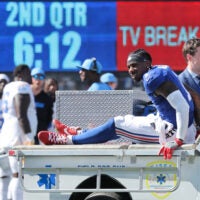 Sep 28, 2025; East Rutherford, New Jersey, USA; New York Giants wide receiver Malik Nabers (1) is carted off the field following an injury during the second quarter against the Los Angeles Chargers at MetLife Stadium.