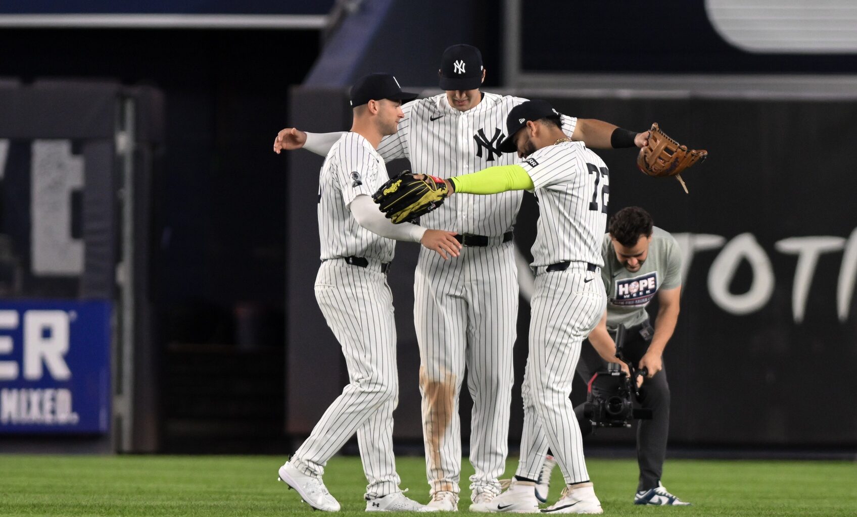 Jun 16, 2026; Bronx, New York, USA; New York Yankees shortstop Max Schuemann (30), right fielder Spencer Jones (78) and shortstop José Caballero (72) celebrate after winning against the Chicago White Sox at Yankee Stadium.