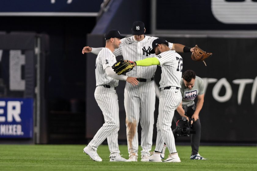 Jun 16, 2026; Bronx, New York, USA; New York Yankees shortstop Max Schuemann (30), right fielder Spencer Jones (78) and shortstop José Caballero (72) celebrate after winning against the Chicago White Sox at Yankee Stadium.