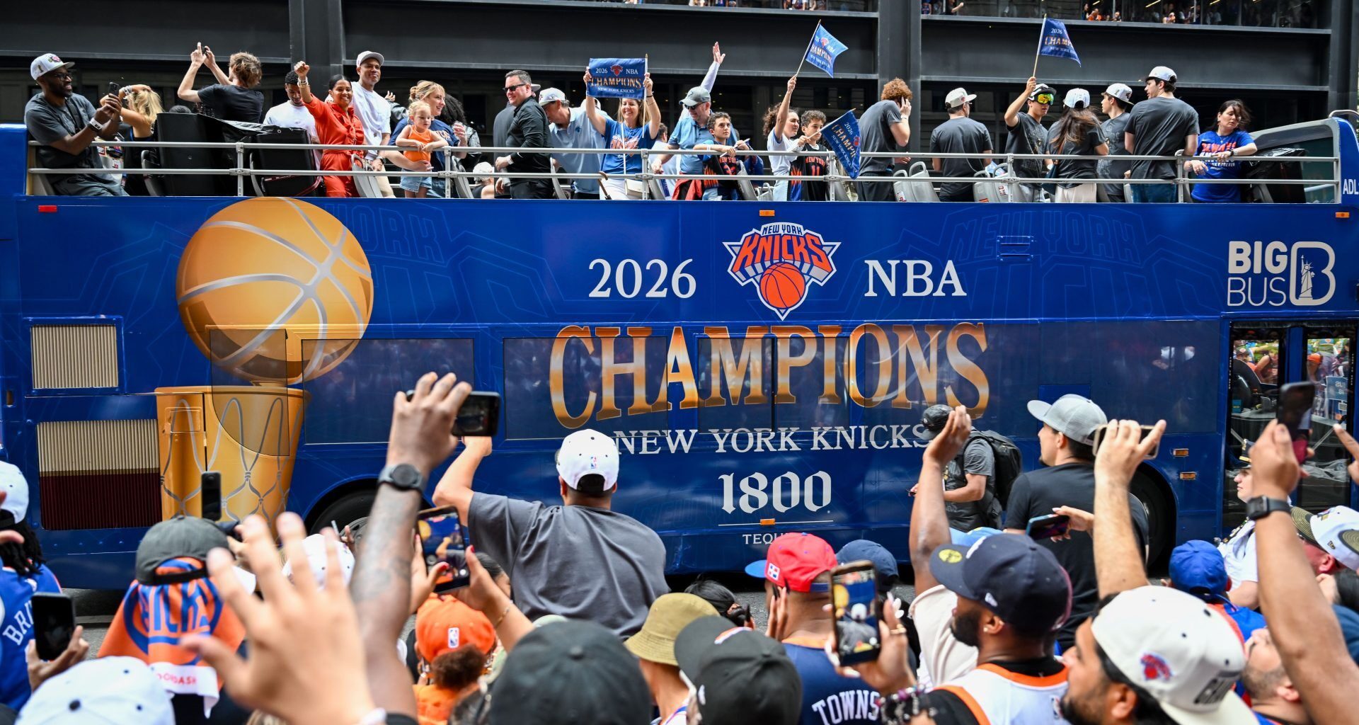 Jun 18, 2026; New York, NY, USA; A New York Knicks Champions bus passes during the New York Knicks Championship Parade through the Canyon of Heroes.