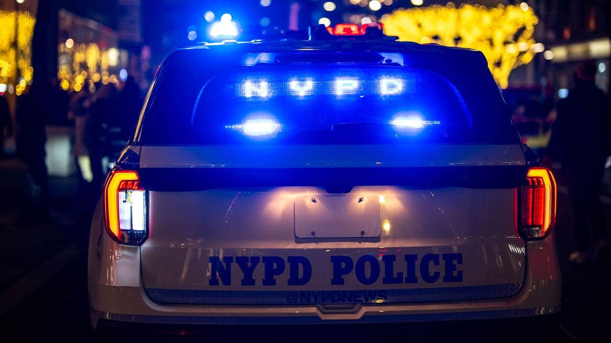NYPD police car stopped in traffic