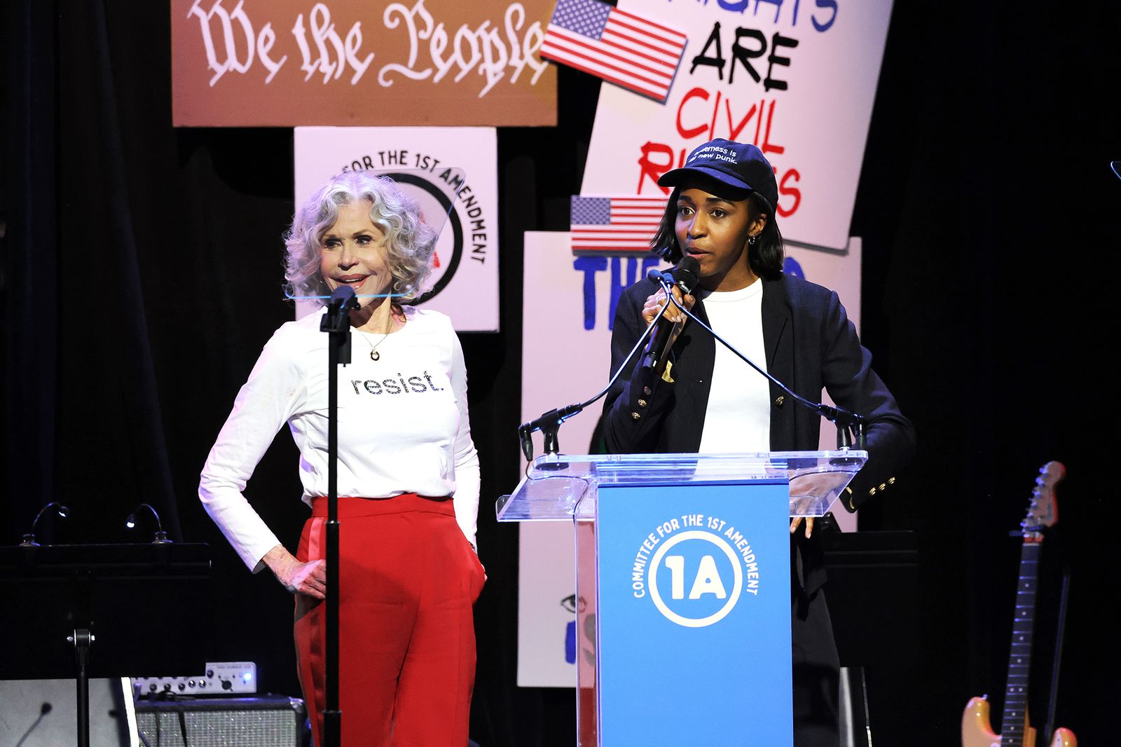 Image may contain Jane Fonda Crowd Person Adult Audience People Face Head Electrical Device Microphone and Speech