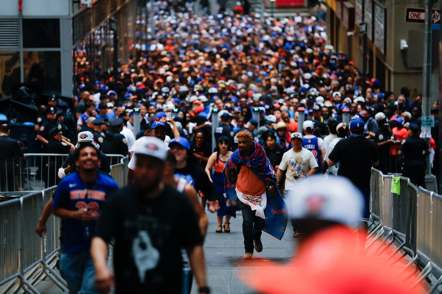 New York Knicks fans pass through a security checkpoint to reach the site of the victory parade for the NBA champions in Lower Manhattan on Thursday.