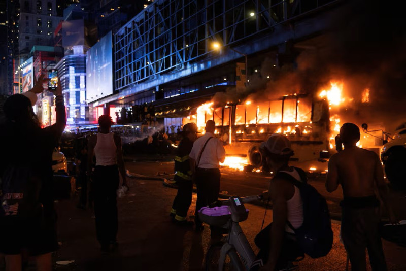 World Cup bus torched as Knicks title celebrations descend into chaos in Manhattan