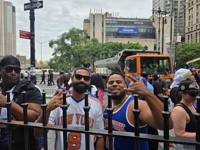 Raymond Calderon and Ismael De La Cruz outside City Hall. Photo by Shane O'Brien. 