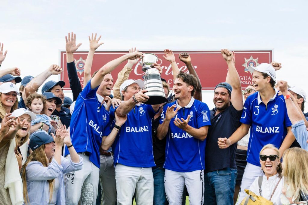 Winning Balanz Capital with the Cartier Queen's Cup. Photo by Art of Polo
