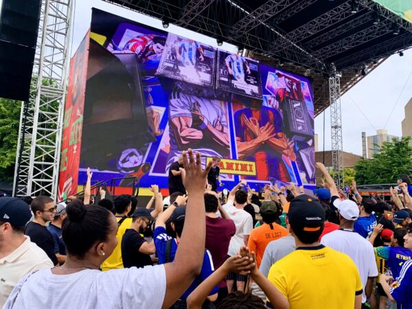 Hands up for collectible freebies. Photo: Mary Frost/Brooklyn Eagle