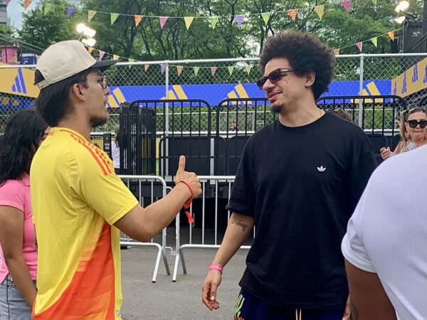Comedian Eric André, right, at the adidas Brooklyn Fan Zone. Photo: Mary Frost/Brooklyn Eagle
