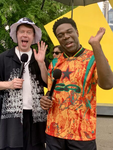 (Left to right) Comedians, actors and best friends Tim Baltz and Sam Richardson during an interview in the Brooklyn Fan Zone. Photo: Mary Frost/Brooklyn Eagle