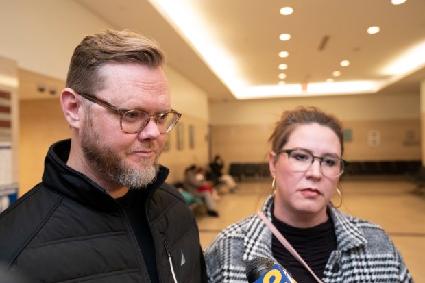 Ethan Williams's parent, Jason and Susan Williams, are pictured outside Brooklyn Supreme Court in 2022.