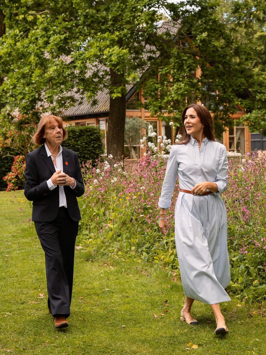 Queen Mary looked effortlessly elegant in a pale blue striped shirtdress while welcoming French activist and author Gisèle Pelicot at Fredensborg Palace.