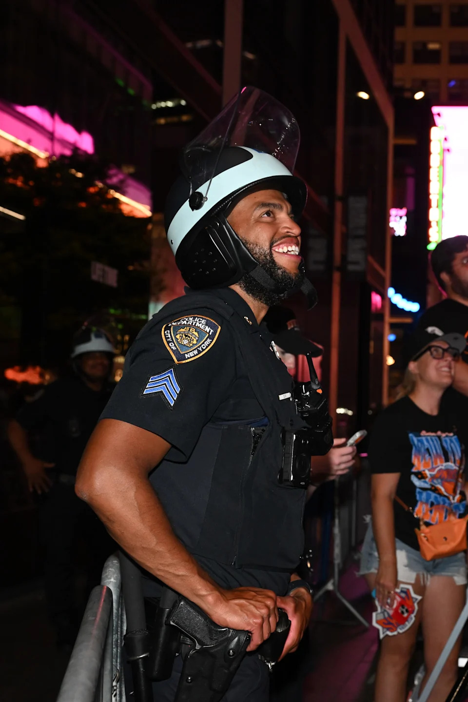 A New York City Police officer reacts outside of Madison Square Garden on Plaza 33 following Game 5 of the NBA Finals between the New York Knicks and the San Antonio Spurs. M