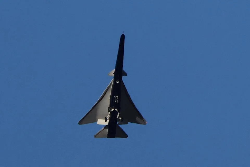 The X-59 Quesst supersonic aircraft in flight against a blue sky. REUTERS