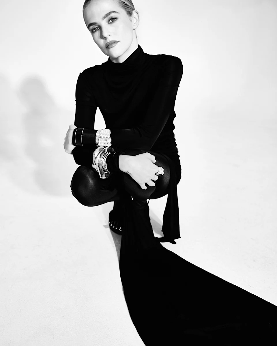 Saint Laurent’s jersey dress, tights and cuffs. Schiaparelli shoes.