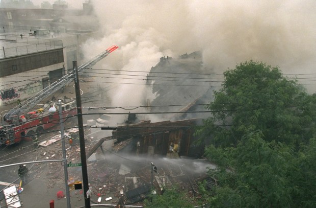 Firefighters battle a five-alarm blaze on Astoria Blvd. in Queens, after an explosion ripped through a three-story house on June 17, 2001. (Ron Antonelli for New York Daily News)