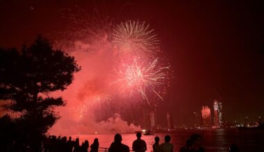 People watch the Macy's 4th of July Fireworks show along the East River, late Sunday, July 4, 2021, in New York.
