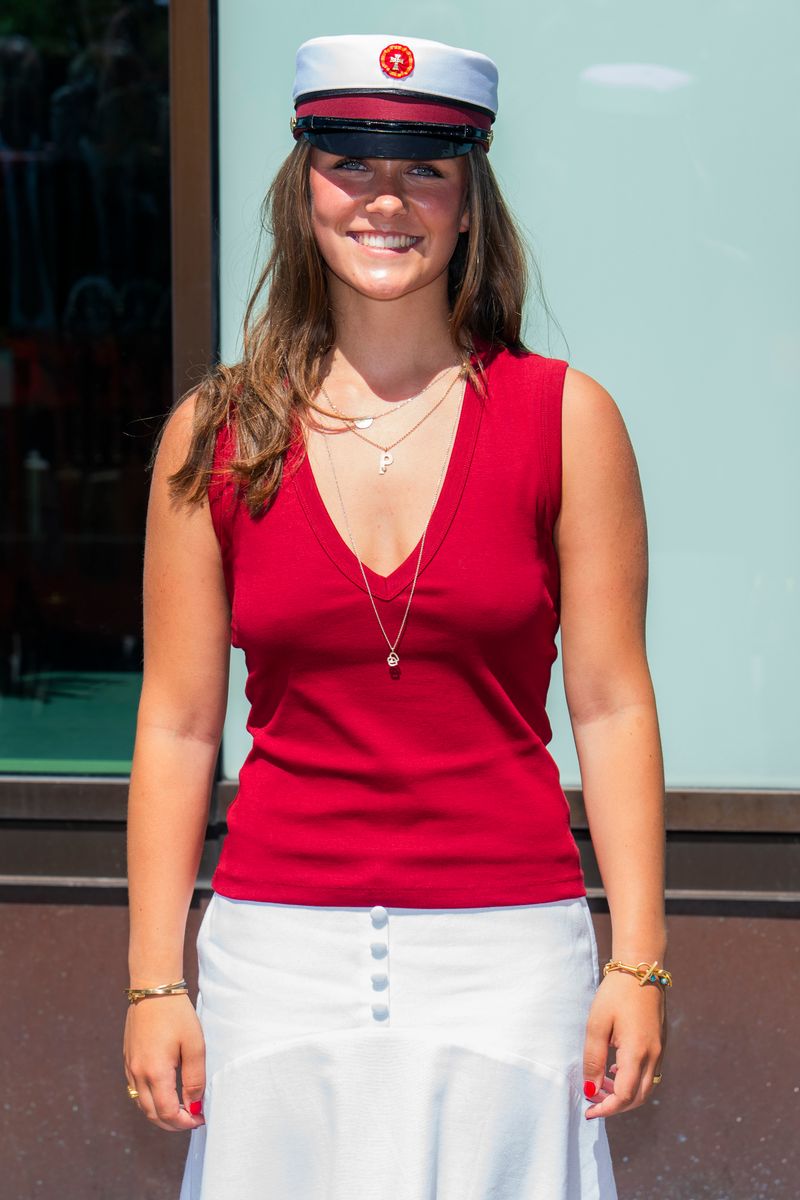Princess Isabella looked elegant in a red sleeveless top and flowing white skirt, paired with the traditional Danish student cap.