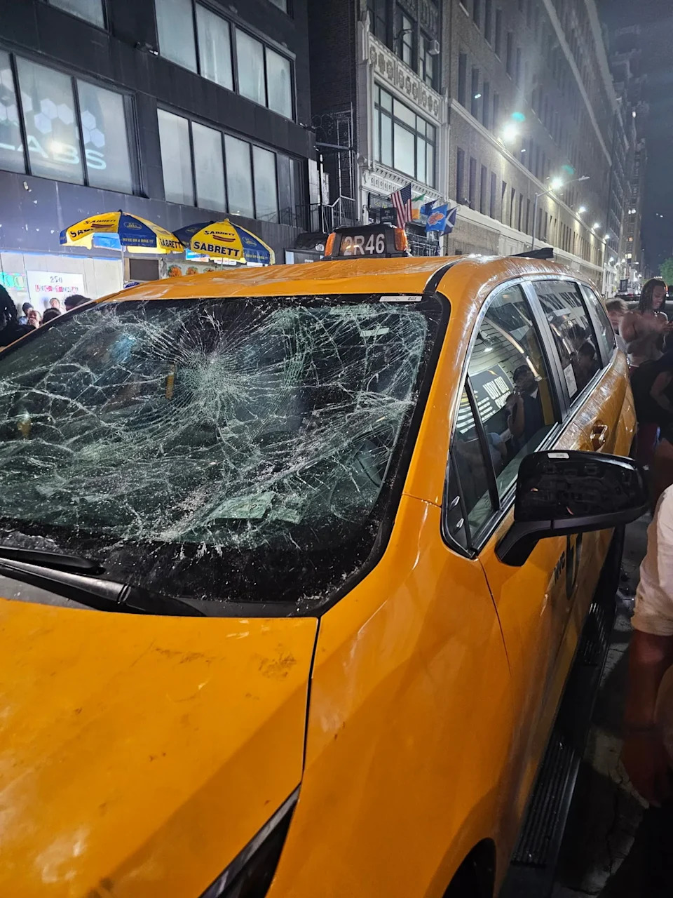 The cab’s windshield was completely cracked and dented, which appeared to be aresult of Knicks fans standing on it (GoFundMe / Zachery Dereniowski and New York Taxi Workers Alliance)