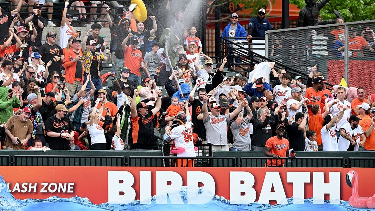 Baltimore Orioles fans celebrating in the Bird Bath at Oriole Park at Camden Yards.