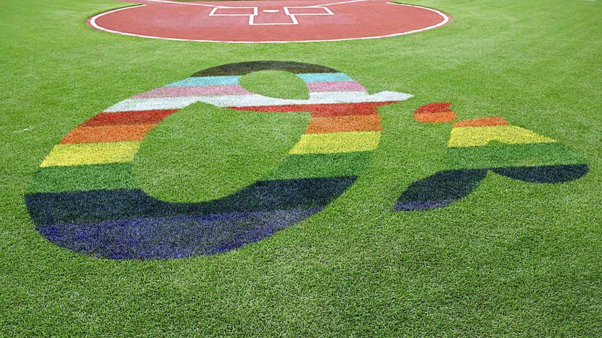 Baltimore Orioles logo painted on field at Oriole Park at Camden Yards.