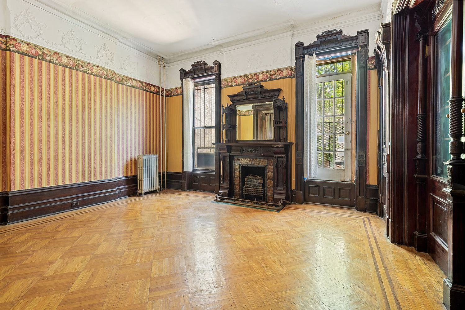 rear parlor with mantel, moldings, built-ins