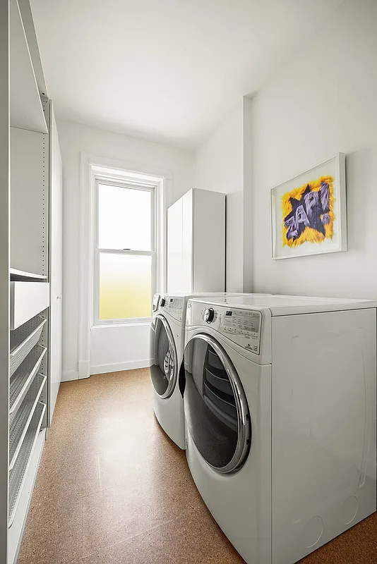 laundry room with full size machines and counterspace