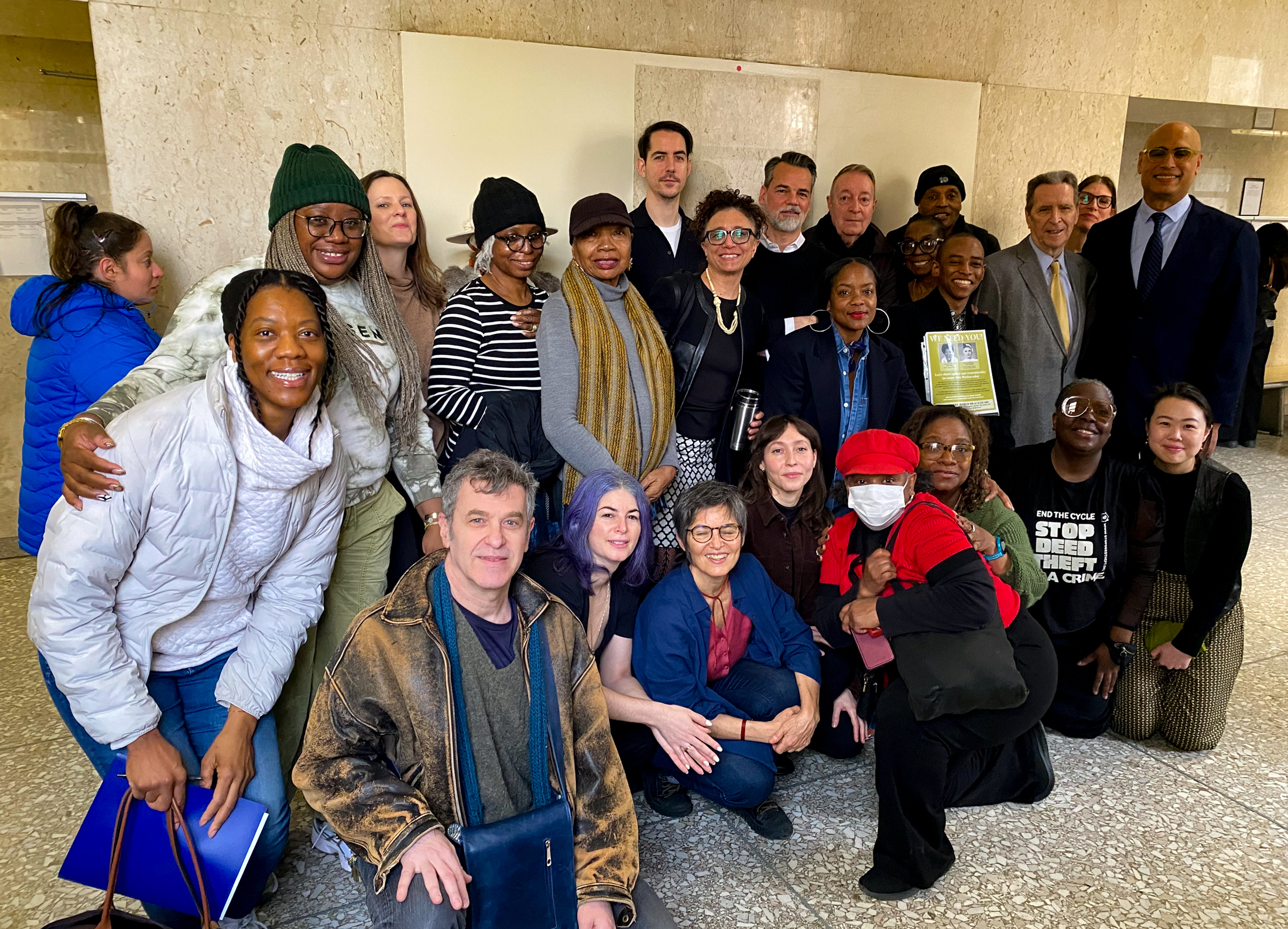 group posing in courthouse lobby