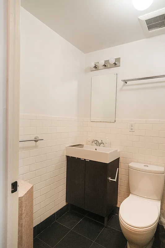 bathroom with white subway tile