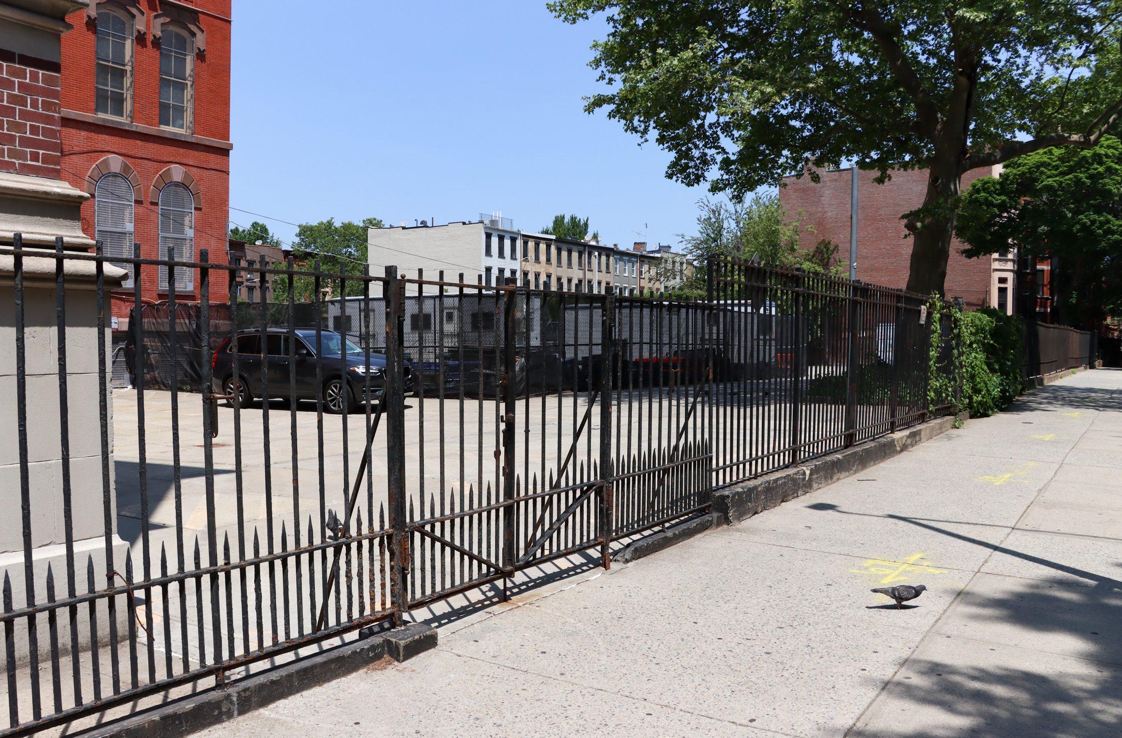 view on macon street of the parking lot behind the school