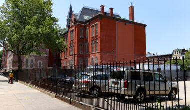 view on macon street of the parking lot and the school