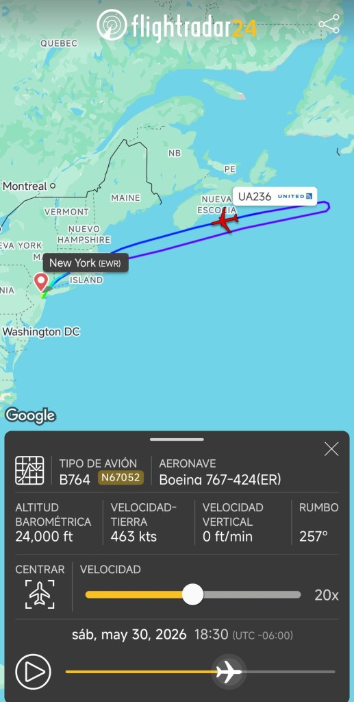 Screenshot from Flightradar24 showing United flight UA236 on a map, flying from New York (EWR), making a U-turn over the Atlantic Ocean, with flight details like altitude, speed, and aircraft type.