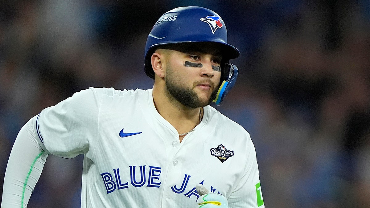 Toronto Blue Jays designated hitter Bo Bichette running after hitting a home run.
