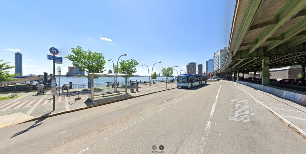 A New York City street view of Marginal Street alongside the East River, showing a bus stop, waterfront promenade, and the East 34th Street Ferry Landing.