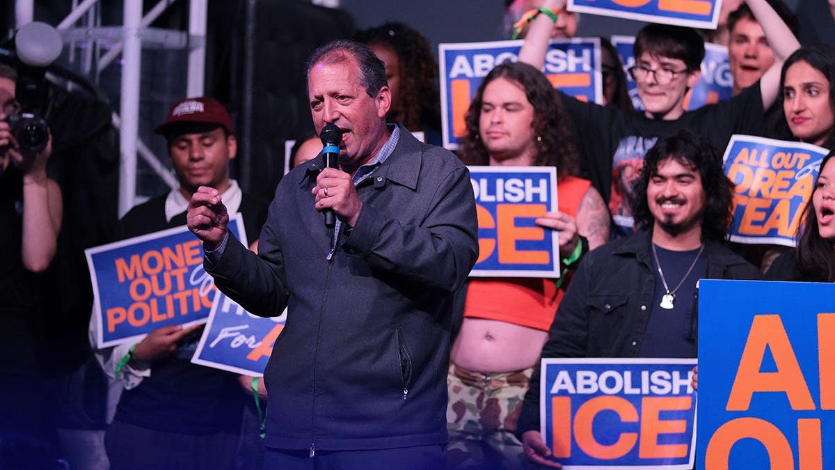Democratic candidate Brad Lander speaking on stage at an election rally in Brooklyn
