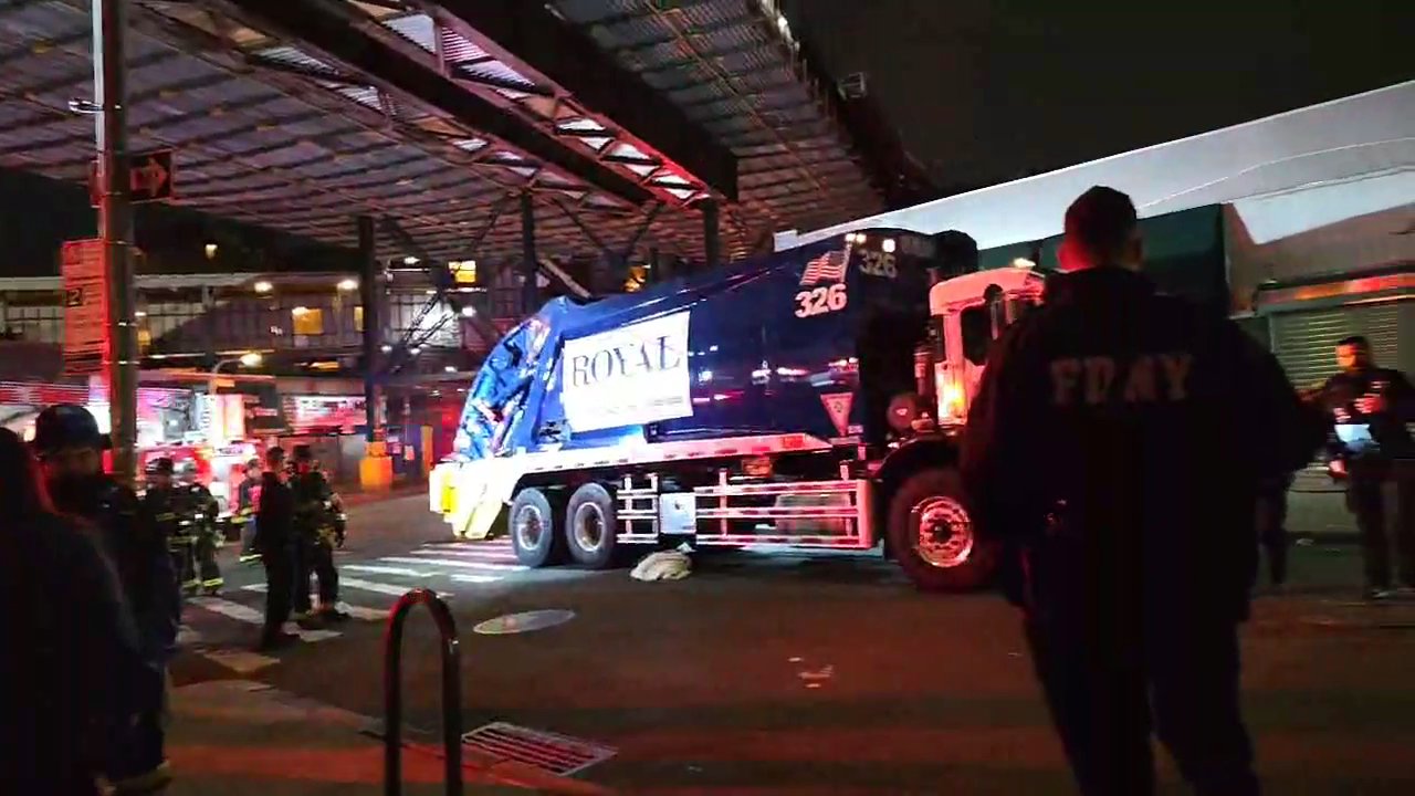 Police from the 108th Precinct in Long Island City responded to a 911 call of a pedestrian struck at the intersection and found the victim trapped beneath the garbage truck. 