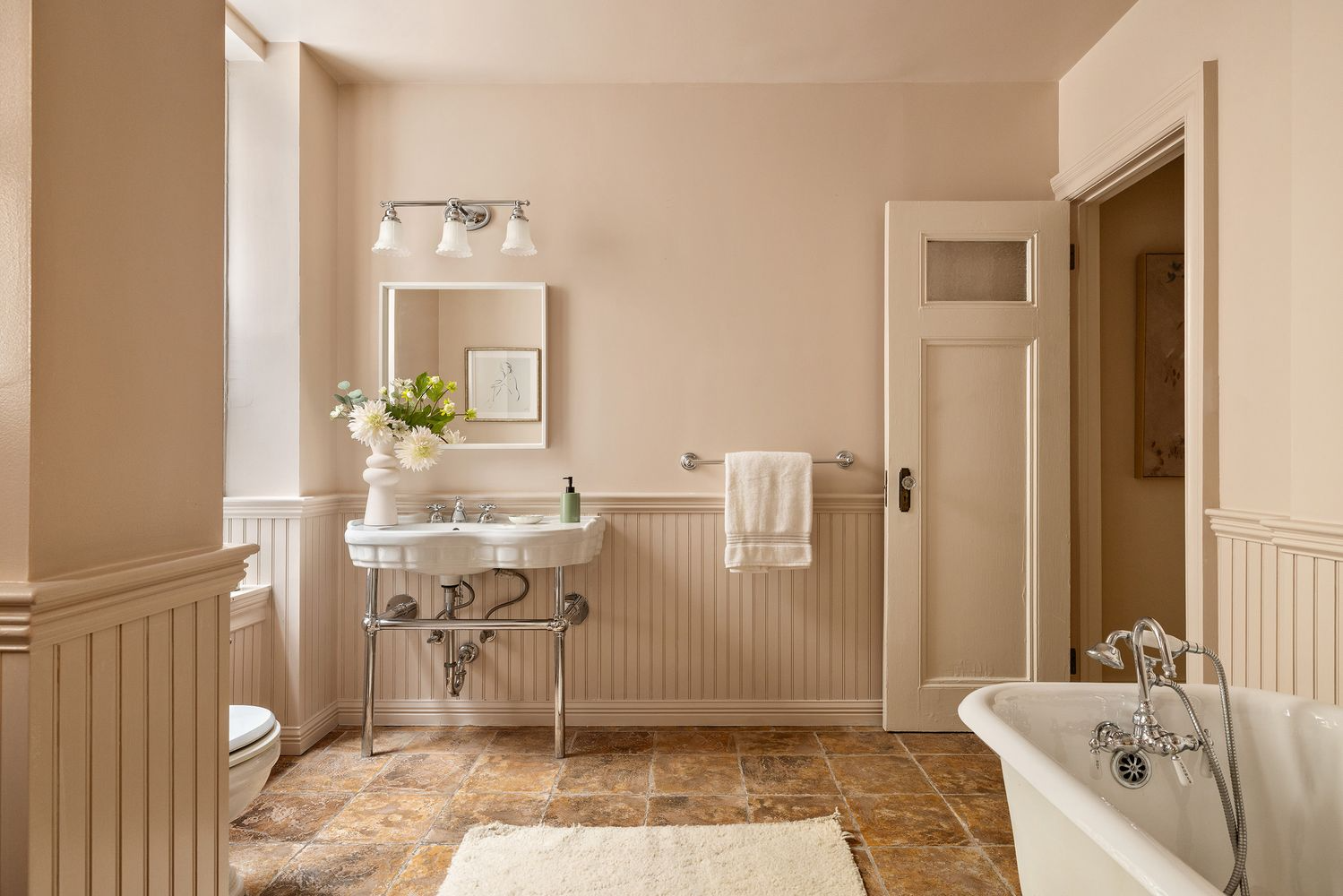 bathroom with beadboard, white console sink