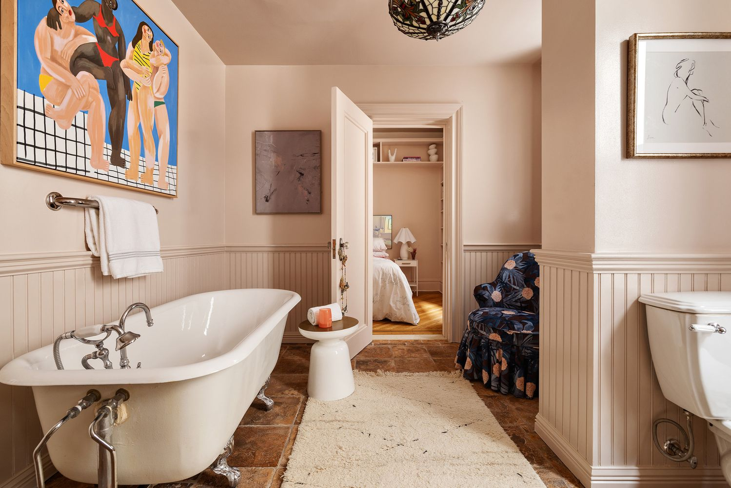 bathroom with cast iron tub, beadboard