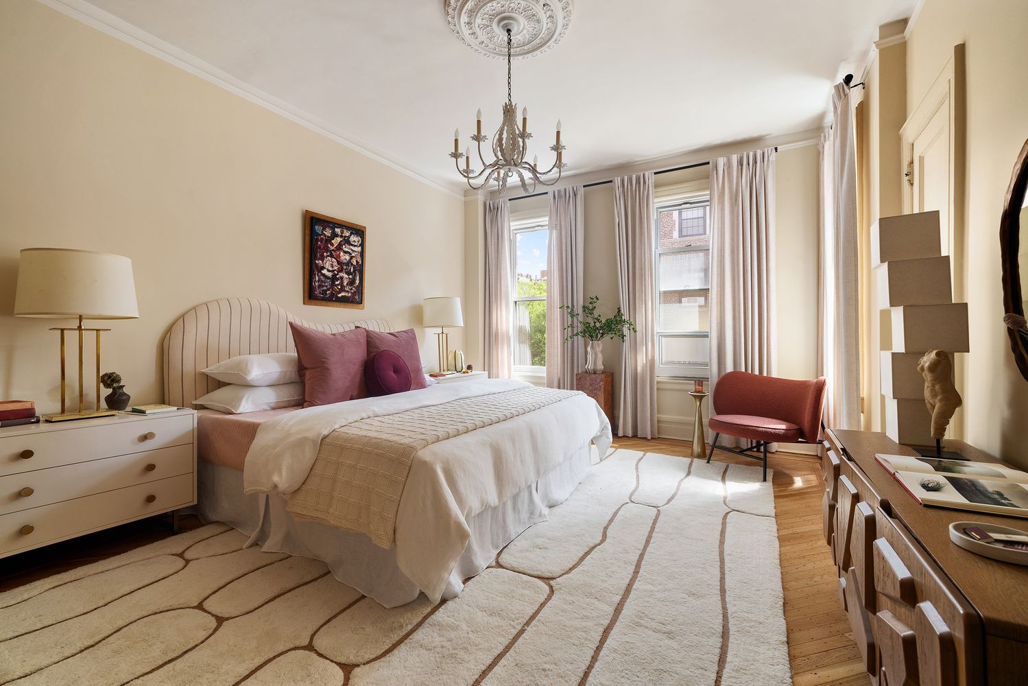 bedroom with tall ceiling, two exposures, ceiling medallion