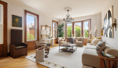 living room with two exposures, wood floor