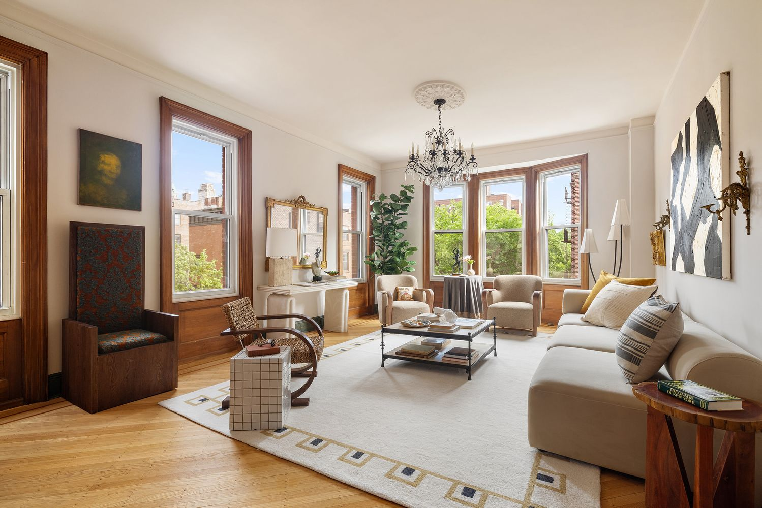 living room with two exposures, wood floor