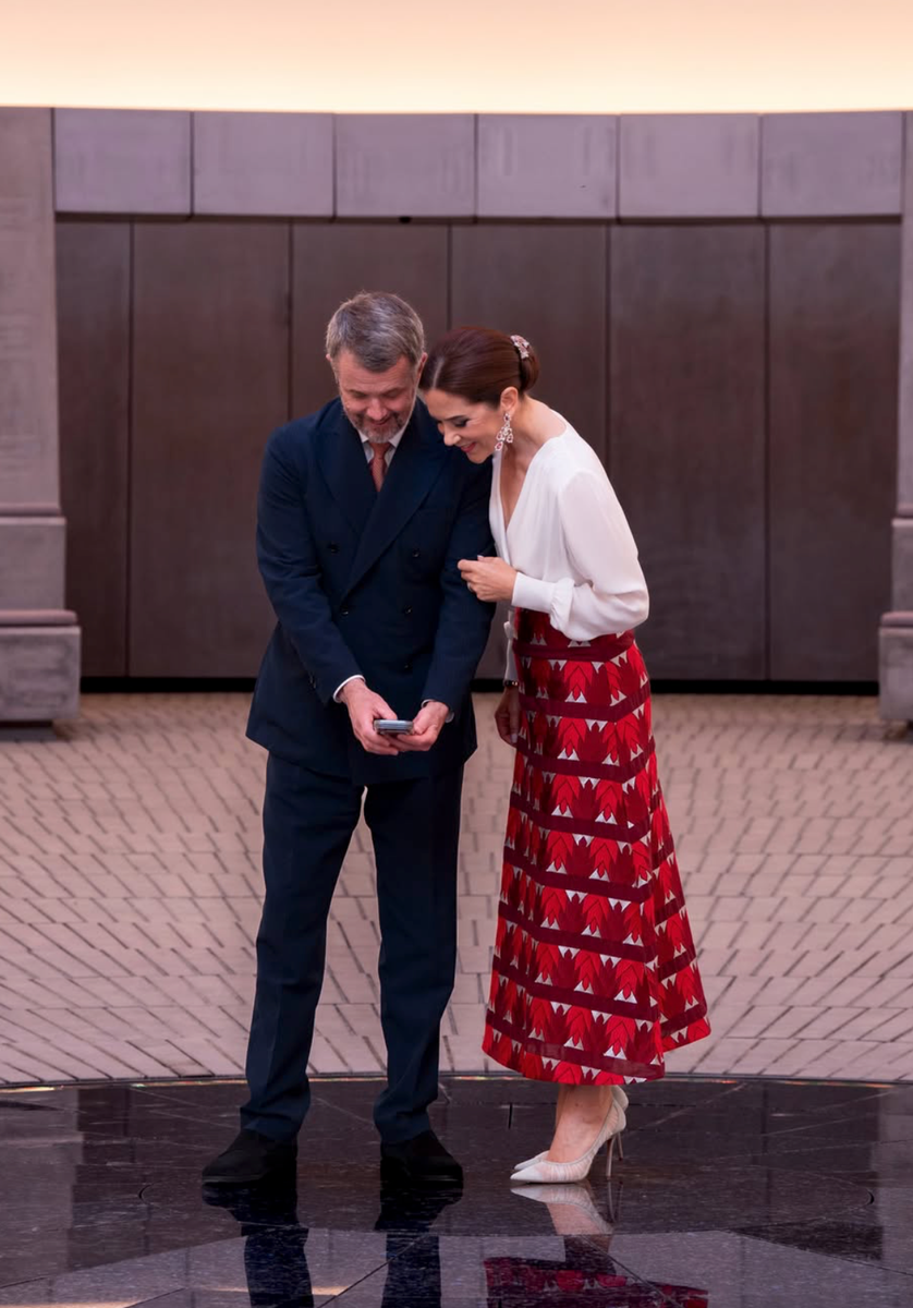 The royal couple toured the museum together as Queen Mary balanced a bold statement piece with timeless wardrobe staples.