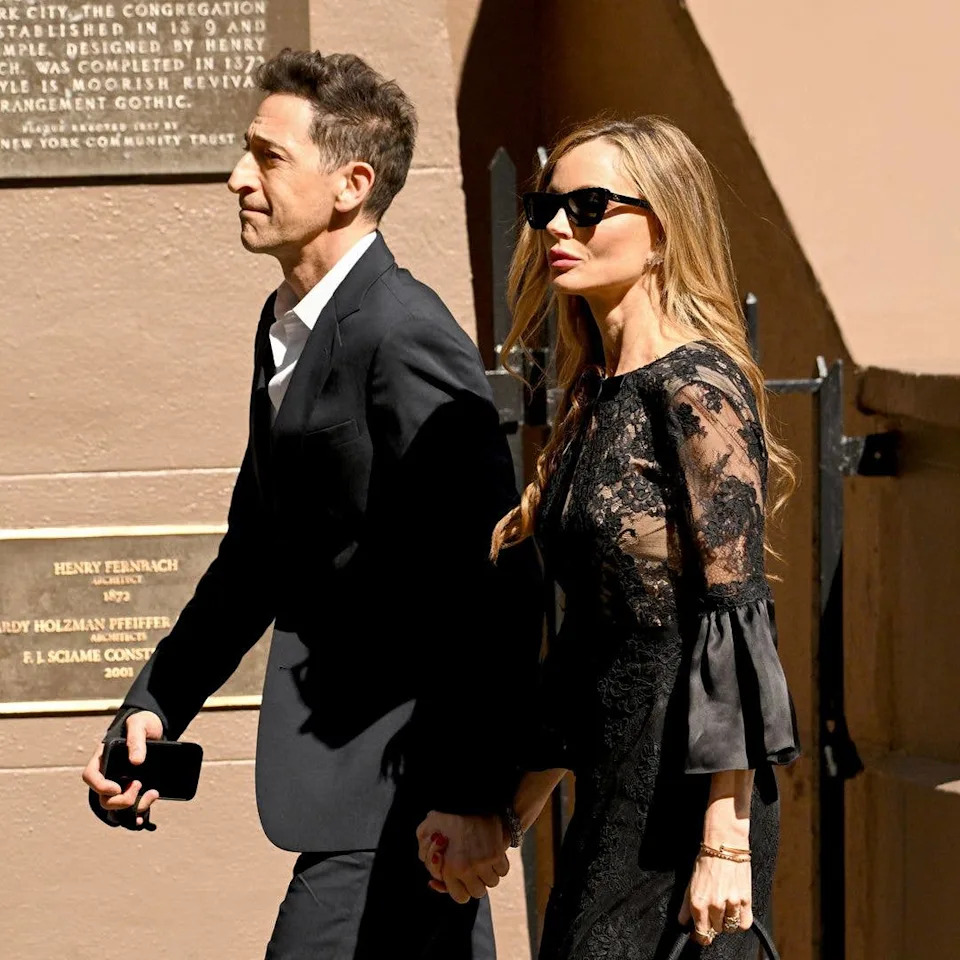 Adrien Brody and Georgina Chapman attend the funeral of Clive Davis on June 29, 2026 in New York City.