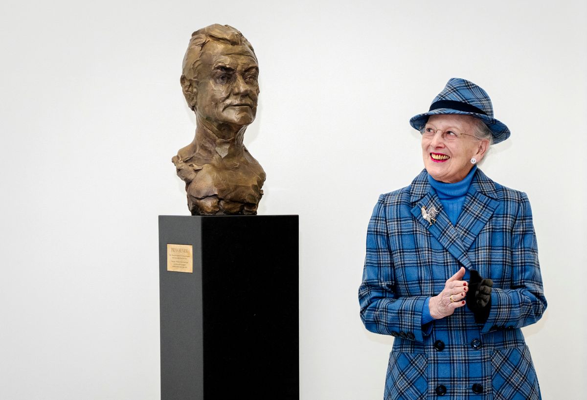 Queen Margrethe reacts after unveiling a bust of her husband Prince Henrik created by Faroese artist and sculptor Hans Pauli Olsen as she attends the inauguration of the new Prins Henriks Skole in Frederiksberg.